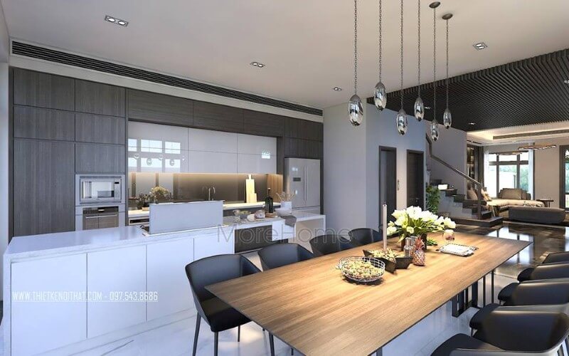 Bàn ăn gỗ nguyên tấm mộc mạc kết hợp đồ nội thất hiện đại sẽ là lựa chọn ấn tượng tạo nên không gian độc đáo cho phòng ăn liền bếp. Thiết kế nội thất