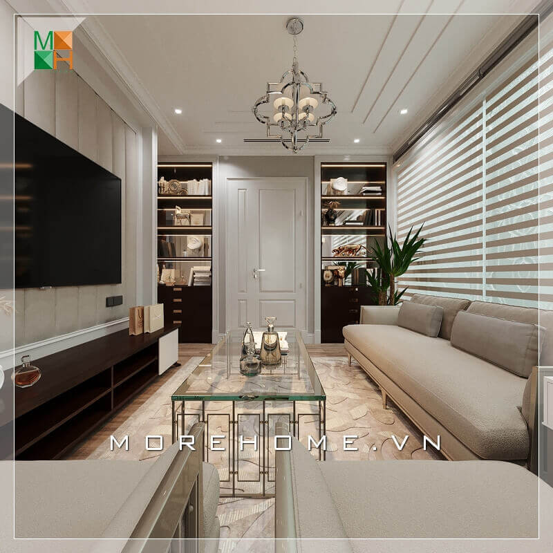 Một phòng khách tân cổ điển đẹp sẽ phải thể hiện được rõ nhất tính năng của nó bằng cách lựa chọn nội thất thông minh và lựa chọn màu sắc phù hợp nhất đối với thiết kế ngôi nhà. Lựa chọn một bộ sofa sang trọng màu kem sữa kết hợp với chiếc bàn bằng kính rất đẳng cấp, Kệ TV nhìn khá đơn giản nhưng rất hài hòa với những nội thất khác trong căn phòng. Sự kết hợp nội thất trong căn phòng khách ăn ý và logic đã tạo nên một không gian phòng khách tiện nghi và sang trọng. Lựa chọn mẫu thiết kế phòng khách độc đáo